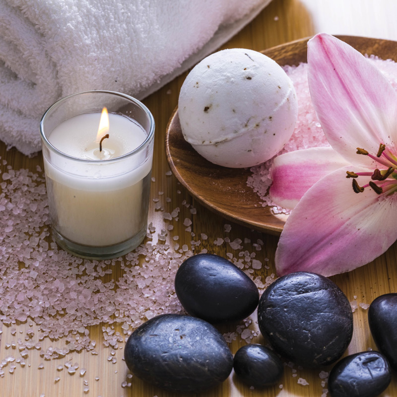 Candles, towel, stones, for massage.